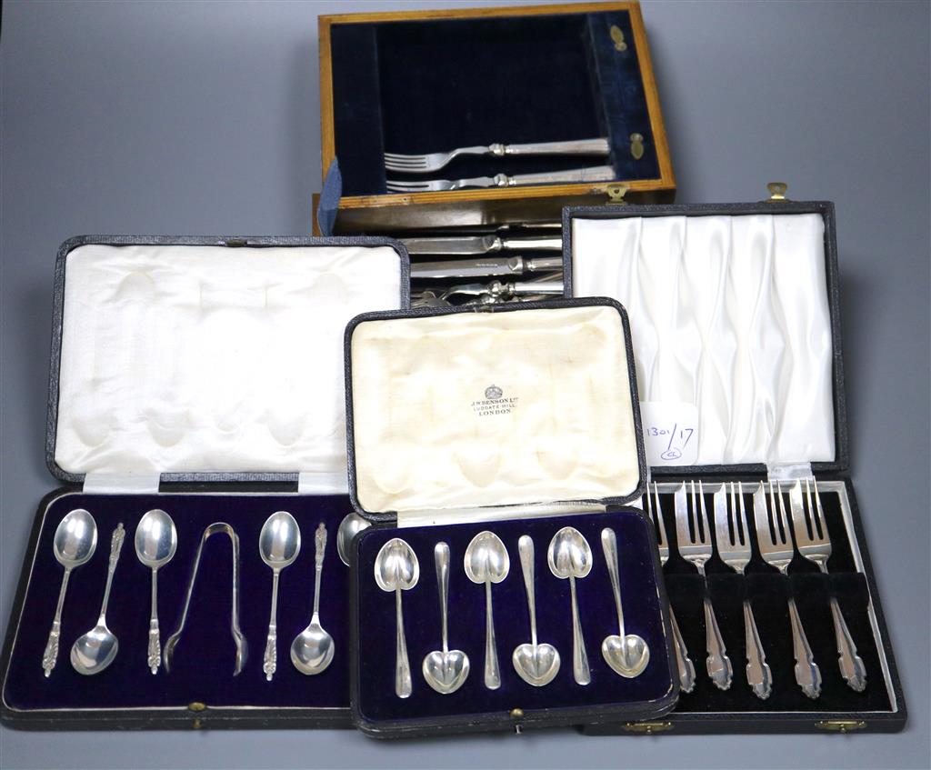 Six silver cake forks, six silver coffee spoons and six silver apostle teaspoons (all cased) and six pairs of dessert eaters